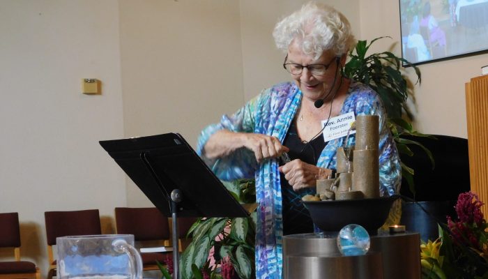 Rev. Annie Foerster leads the annual water service.